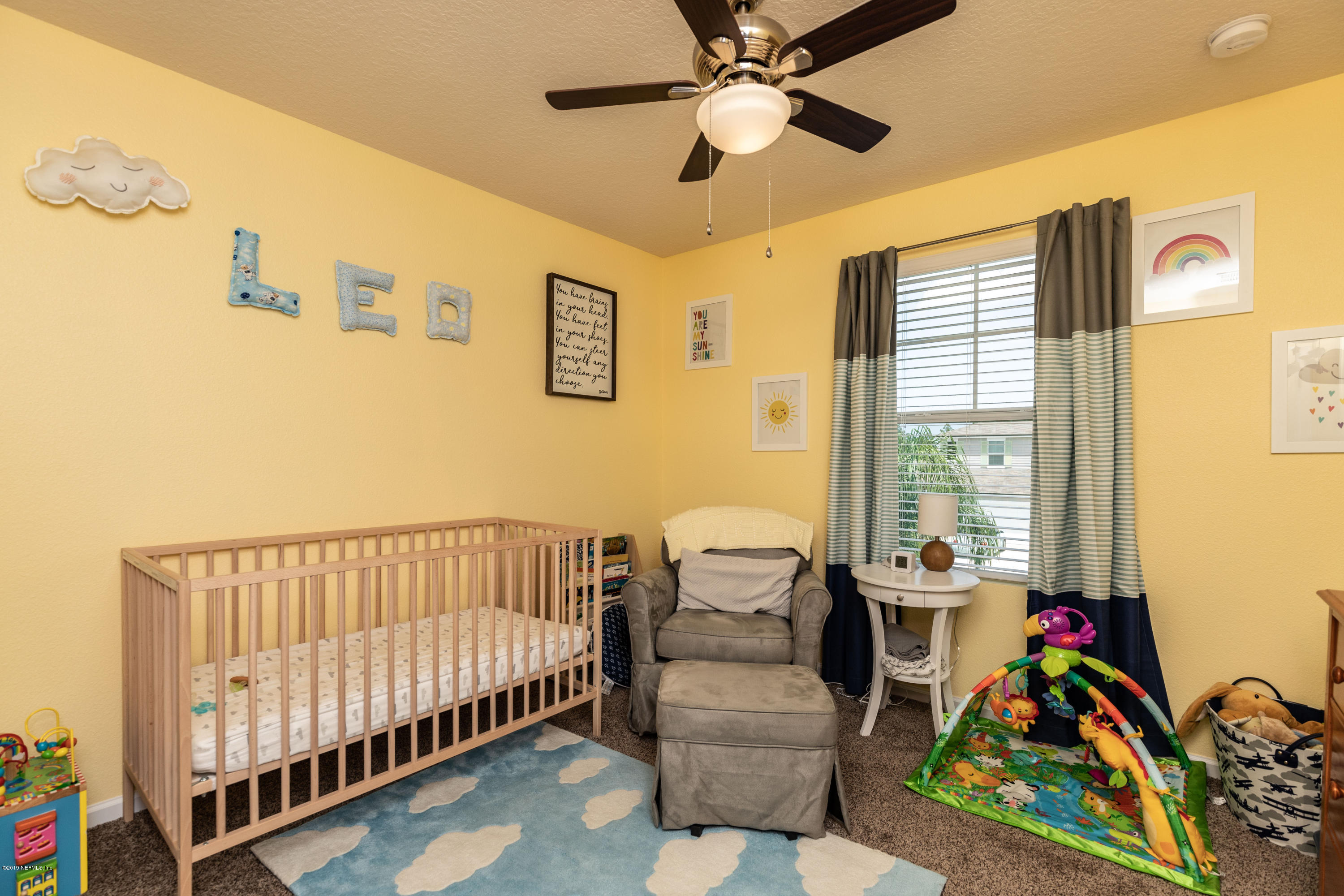 194 Ashby Landing Way St. Augustine, FL 32086 - Photo 35 of 41 a bed room with furniture and a window