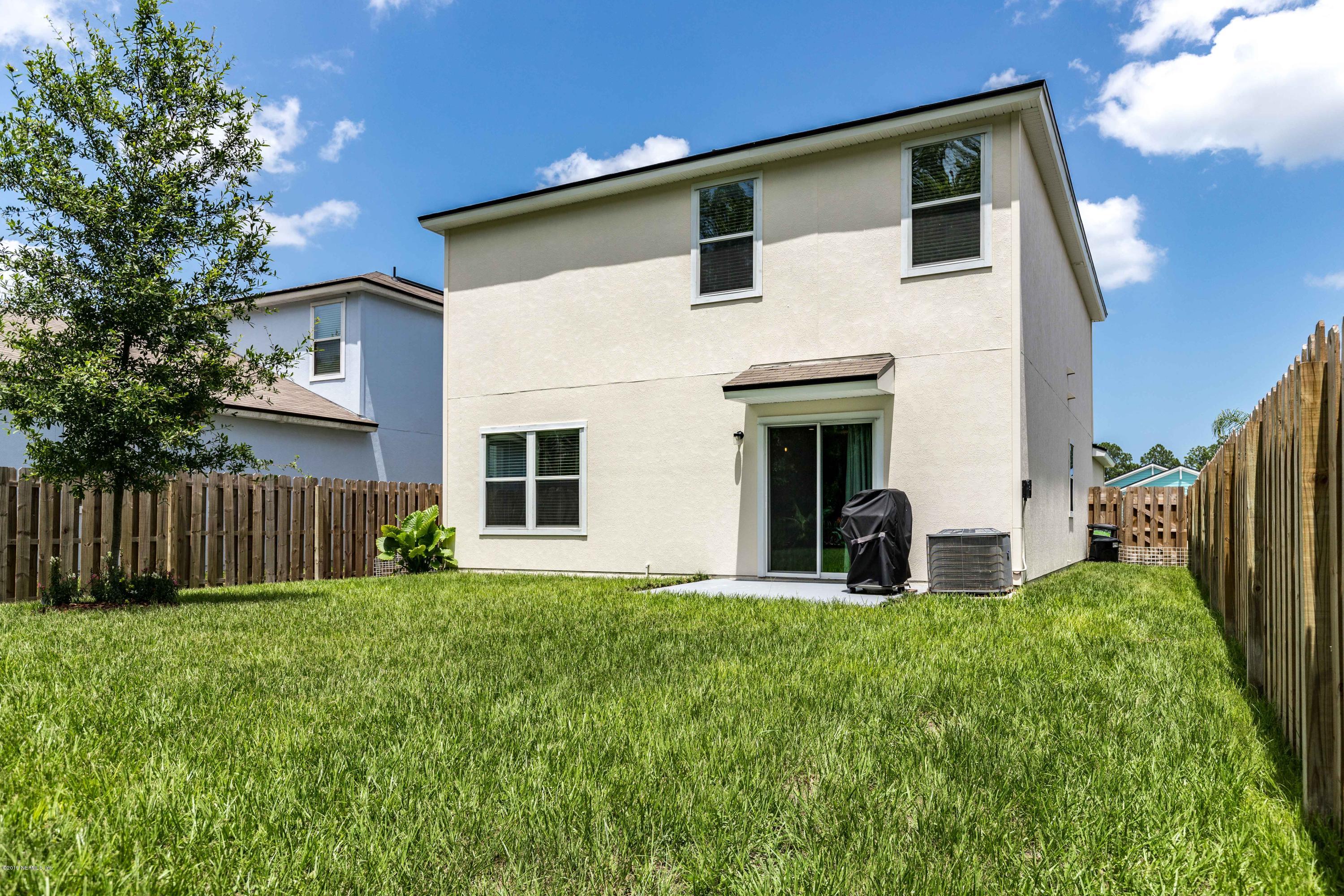 194 Ashby Landing Way St. Augustine, FL 32086 - Photo 36 of 41 a front view of a house with a yard
