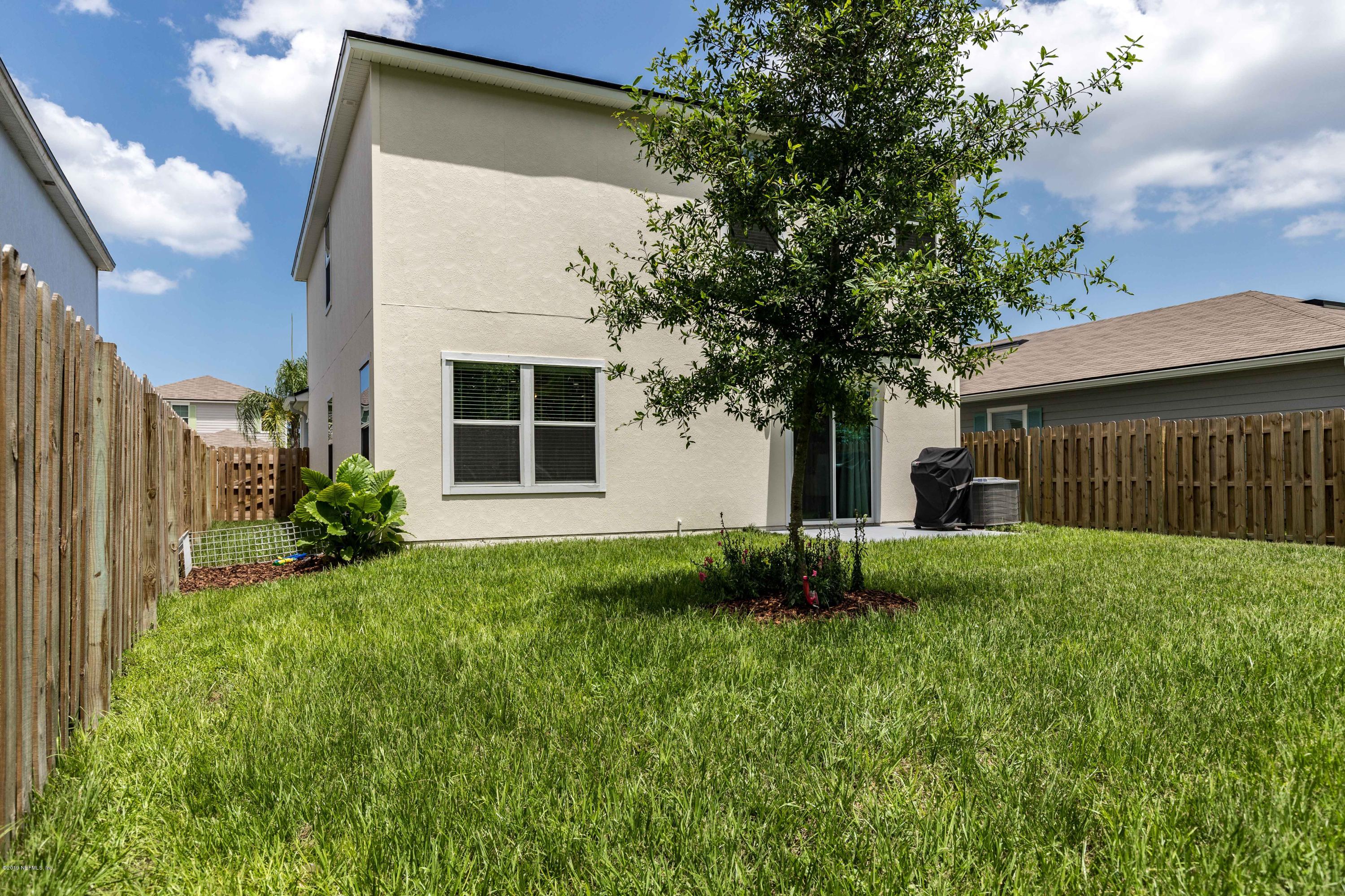 194 Ashby Landing Way St. Augustine, FL 32086 - Photo 38 of 41 a view of a house with backyard and garden