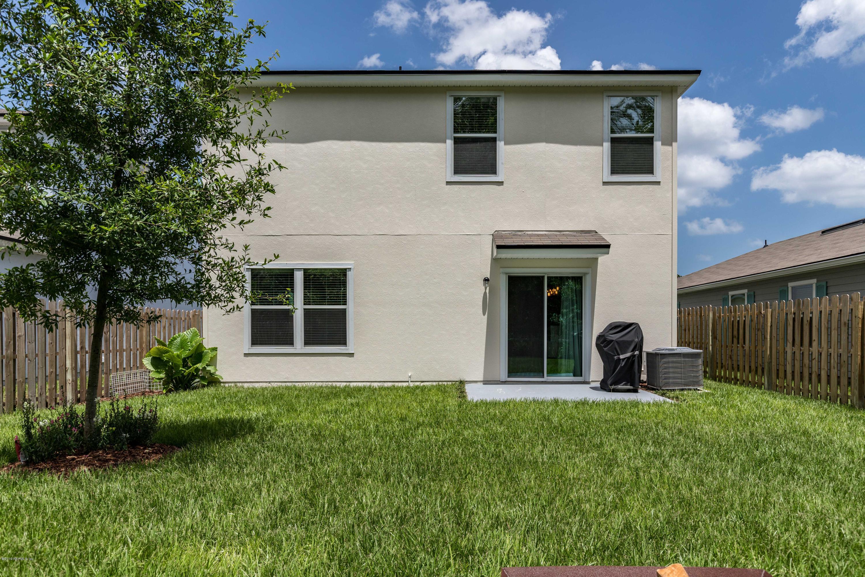 194 Ashby Landing Way St. Augustine, FL 32086 - Photo 39 of 41 a front view of a house with garden