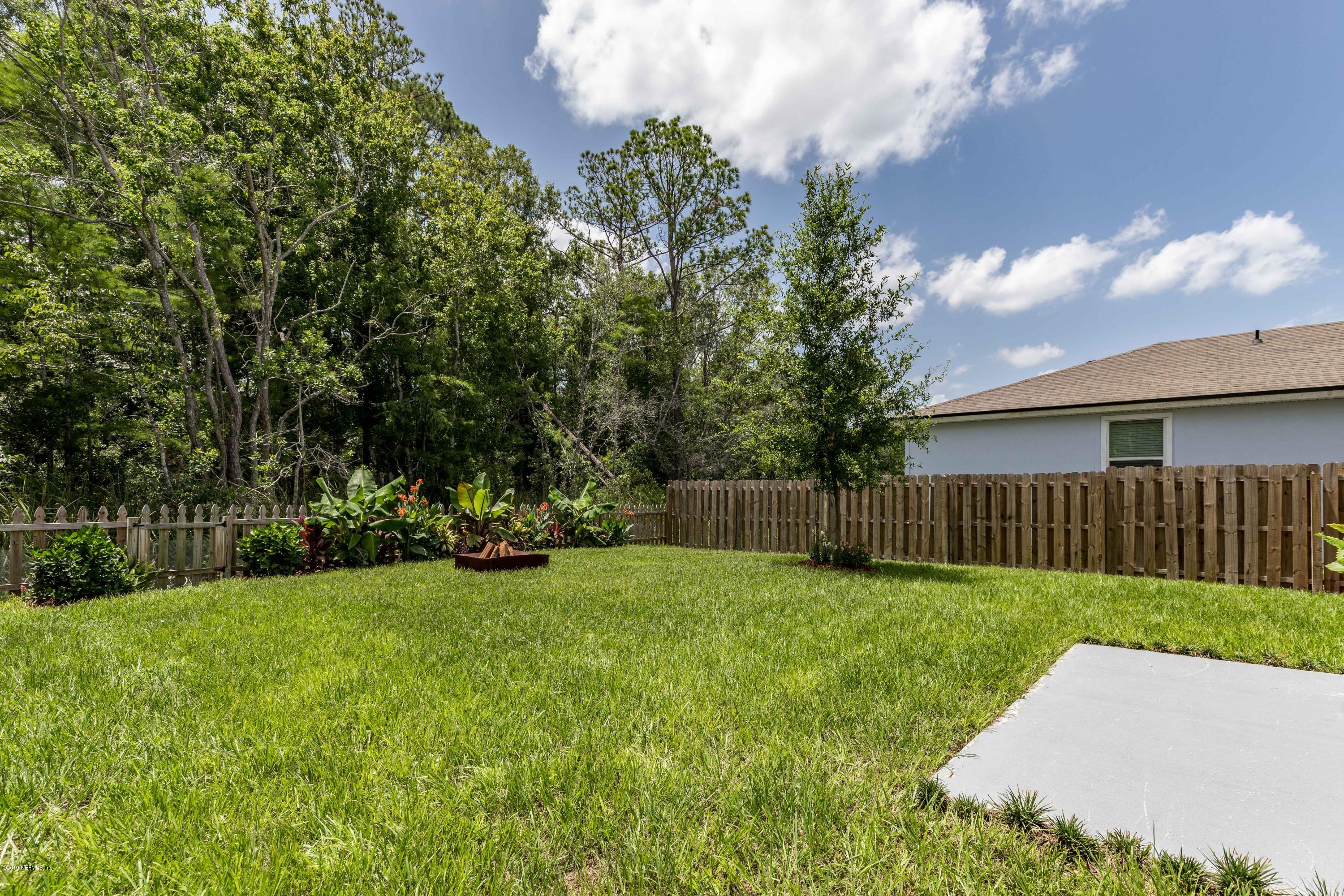 194 Ashby Landing Way St. Augustine, FL 32086 - Photo 41 of 41 a view of a backyard with a garden