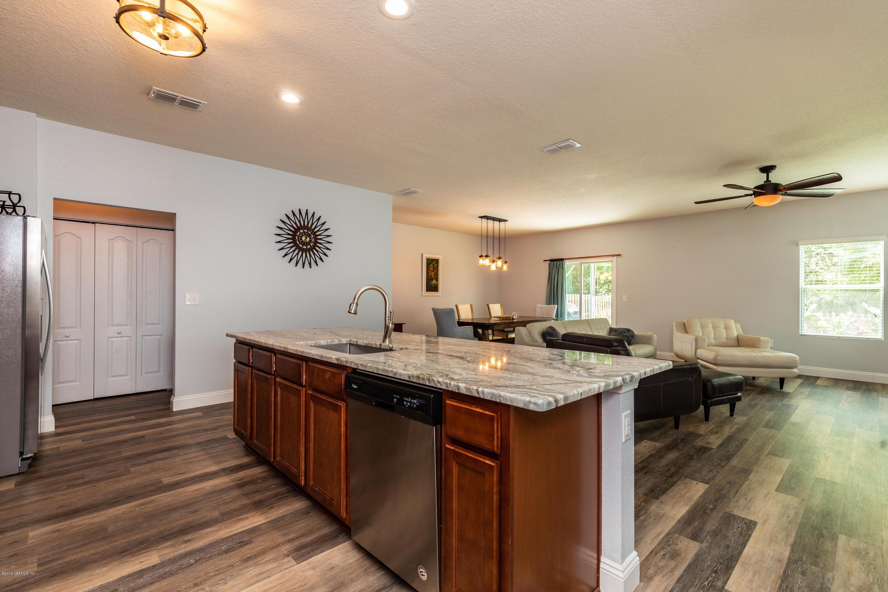 194 Ashby Landing Way St. Augustine, FL 32086 - Photo 7 of 41 a view of a kitchen island wooden floor