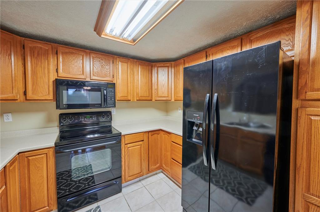 1205 Dutilh Road, Unit 4 Cranberry Township, PA 16066 - Photo 12 of 25 a kitchen with granite countertop stainless steel appliances and counter space