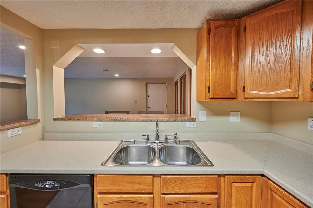 1205 Dutilh Road, Unit 4 Cranberry Township, PA 16066 - Photo 14 of 25 a kitchen with a sink cabinets and a wooden floor
