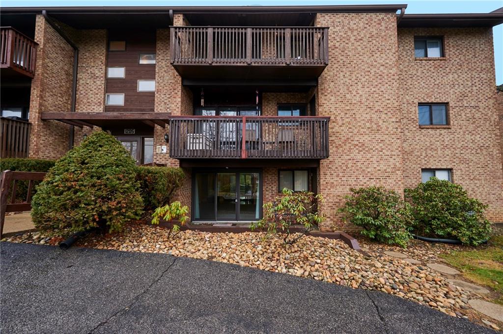 1205 Dutilh Road, Unit 4 Cranberry Township, PA 16066 - Photo 2 of 25 a front view of a house with entryway