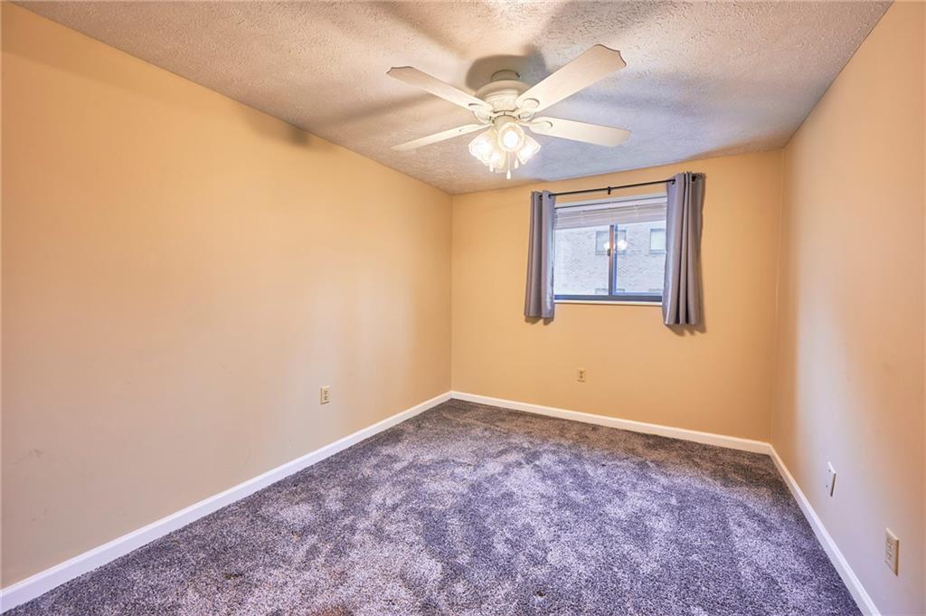 1205 Dutilh Road, Unit 4 Cranberry Township, PA 16066 - Photo 21 of 25 an empty room with windows and fan