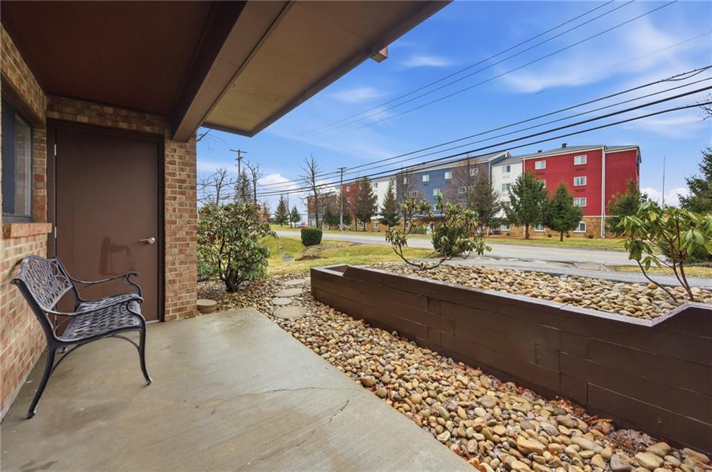 1205 Dutilh Road, Unit 4 Cranberry Township, PA 16066 - Photo 25 of 25 a living room with couch and a table