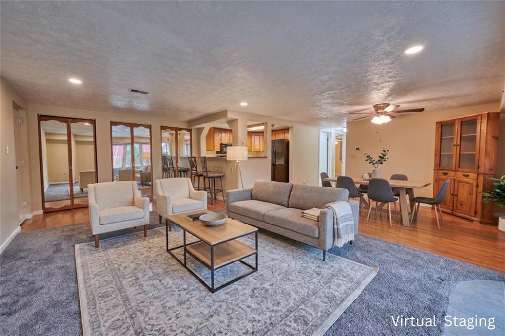 1205 Dutilh Road, Unit 4 Cranberry Township, PA 16066 - Photo 9 of 25 a living room with furniture potted plant and a large window