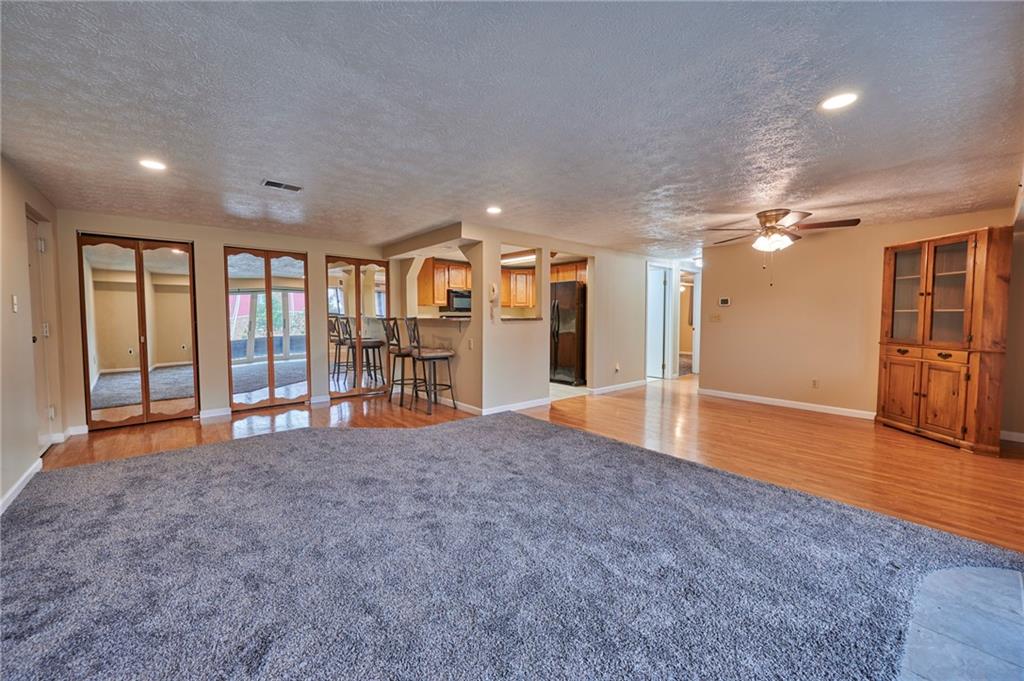 1205 Dutilh Road, Unit 4 Cranberry Township, PA 16066 - Photo 10 of 25 a view of an empty room with window and a kitchen