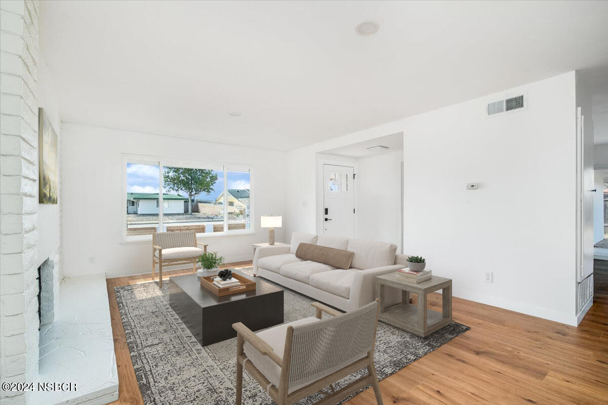 4169 Constellation Road Lompoc, CA 93436 - Photo 3 of 34 a living room with furniture and wooden floor