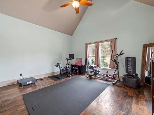 a room with gym equipment and a large window