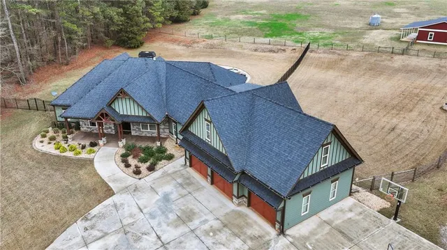 an aerial view of a house having patio