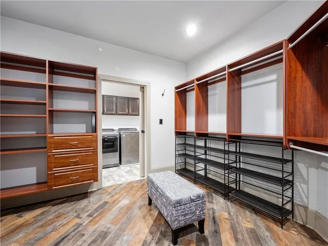 a room with a large bed and furniture