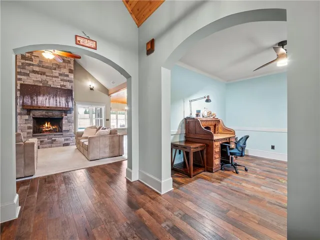 a view of a livingroom with furniture and a fireplace