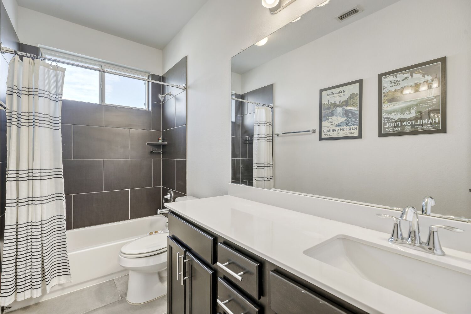 7406 Oberon Street, Unit 69 Austin, TX 78741 - Photo 12 of 16 Second Bathroom (upstairs) featuring vanity, and shower / tub combo.