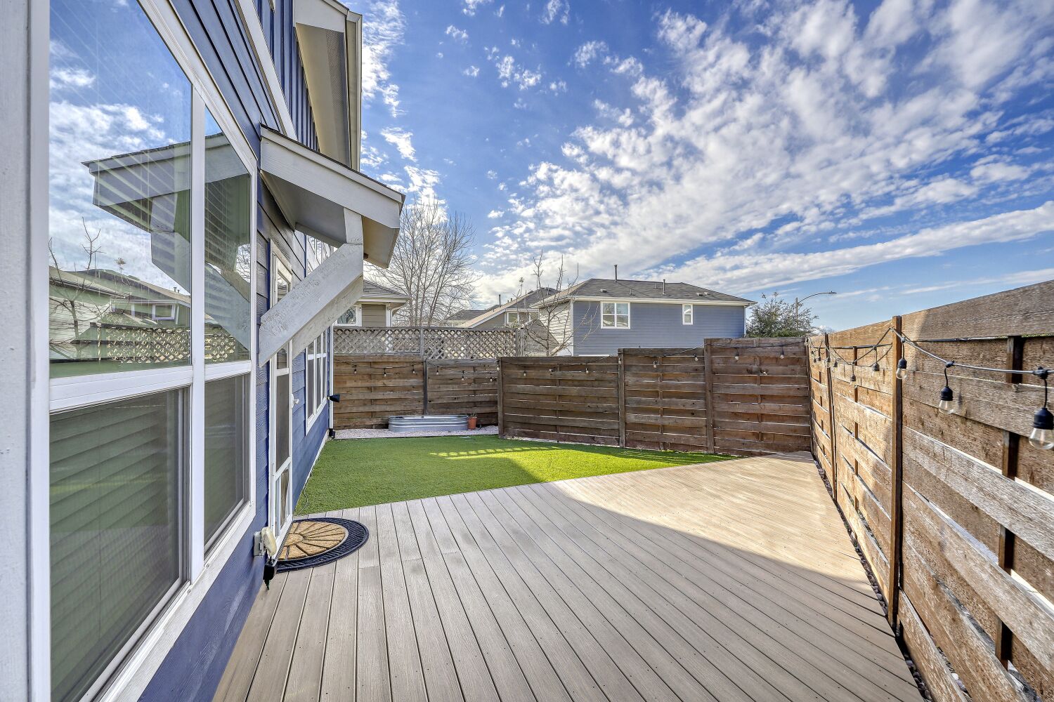 7406 Oberon Street, Unit 69 Austin, TX 78741 - Photo 16 of 16 Wooden terrace with a privacy fenced-in backyard.