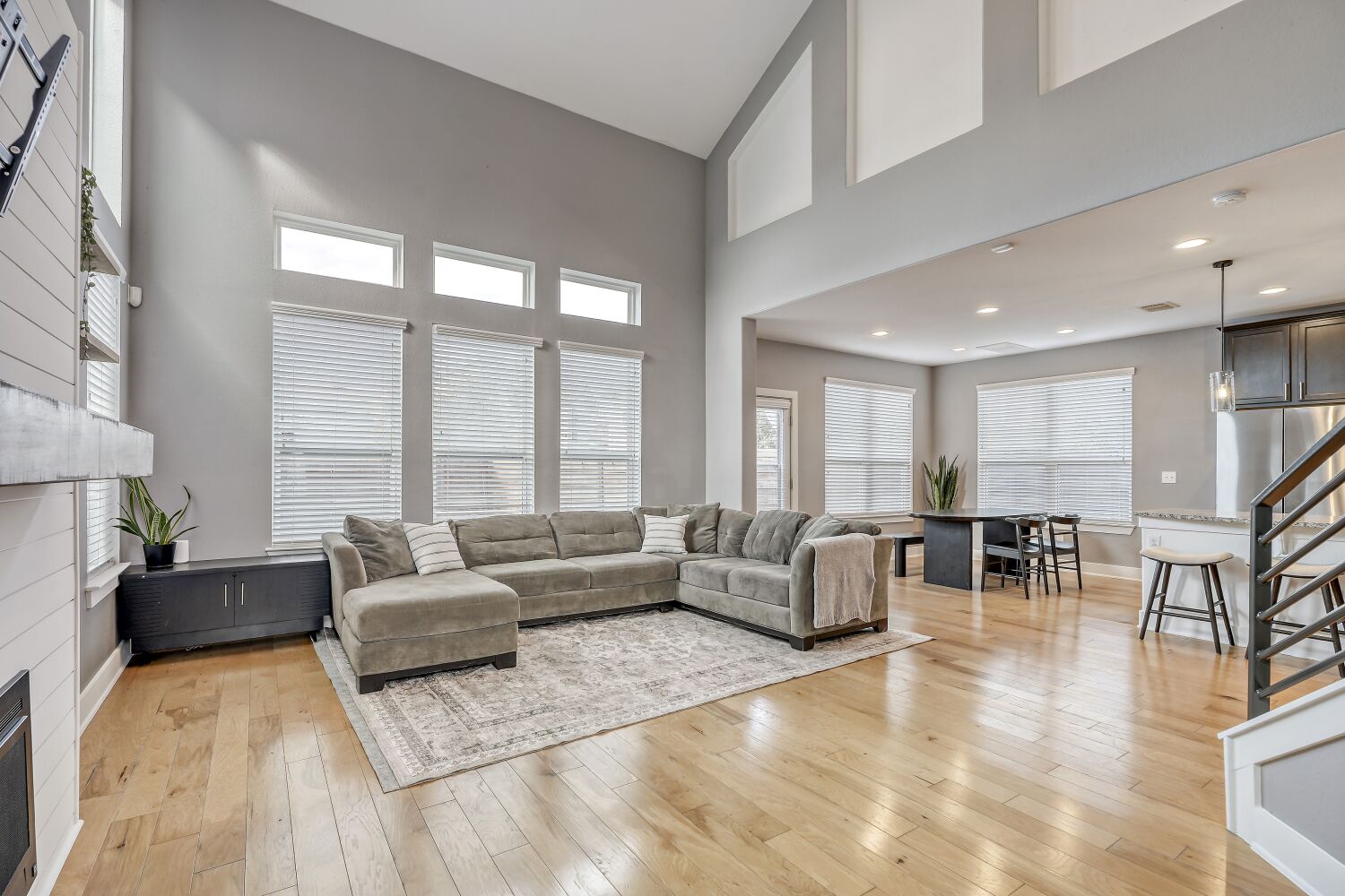 7406 Oberon Street, Unit 69 Austin, TX 78741 - Photo 3 of 16 Living area with a high vaulted ceiling, fireplace, and light wood finished floors.