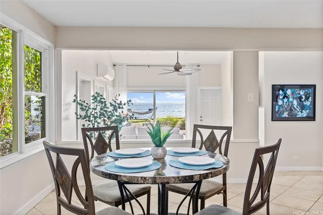 a view of a dining room with furniture and window