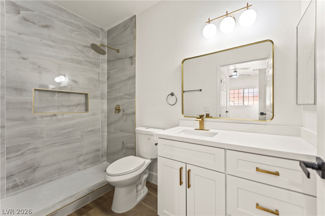 4730 East Craig Road, Unit 1053 Las Vegas, NV 89115 - Photo 16 of 32 A refined bathroom featuring a spacious walk-in shower with sleek marble-look tiling and modern fixtures.