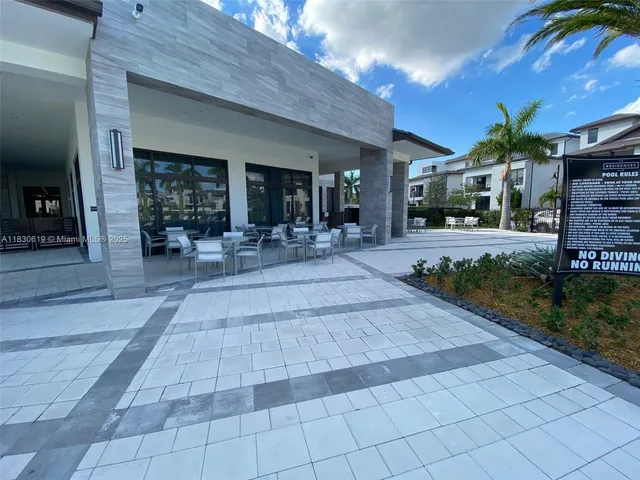 a view of a building with sitting area