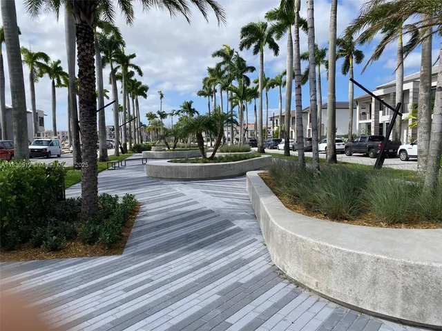 a view of a yard with palm trees