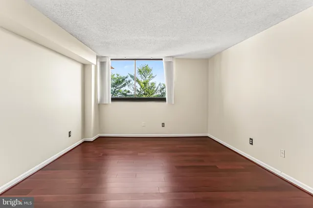 a view of cabinets and wooden floor
