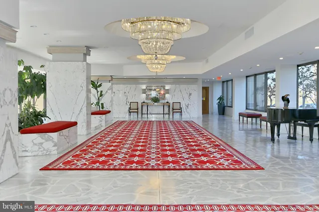 a very nice looking dining room with a rug table and chairs