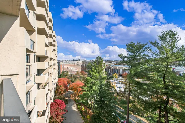 a view of a swimming pool with outdoor seating