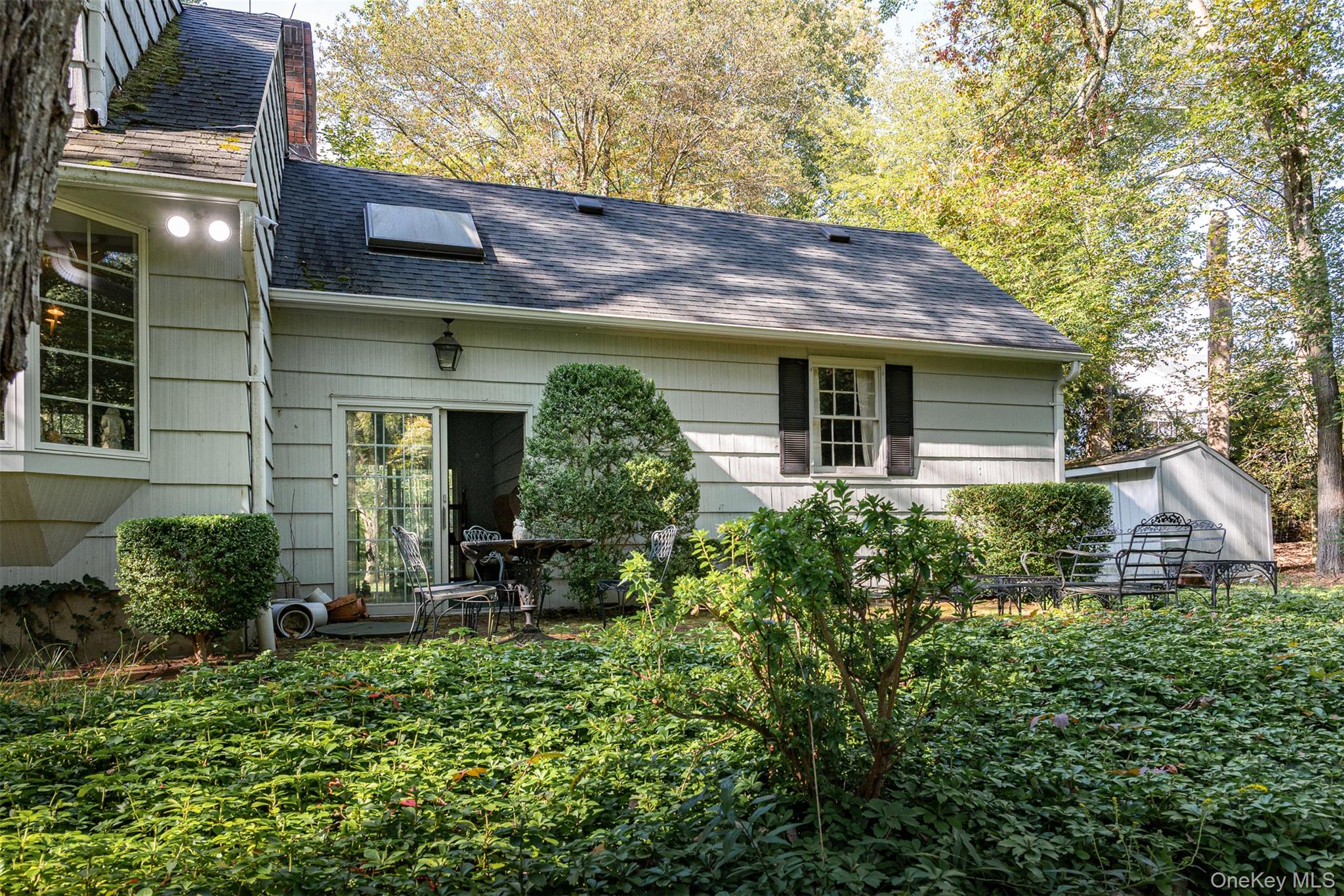 5 Hadley Road Armonk, NY 10504 - Photo 9 of 18 a view of a house with sitting area and garden