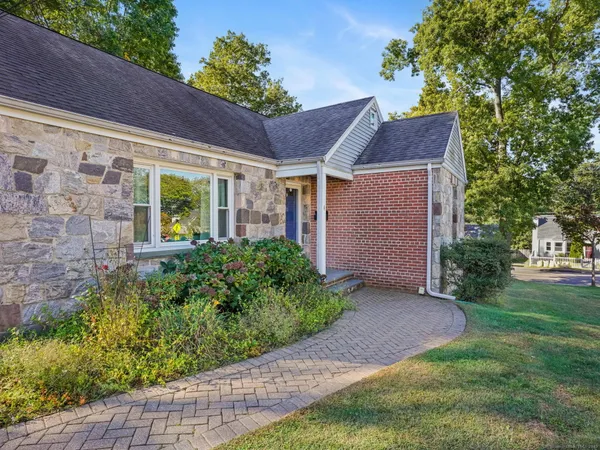 a front view of a house with garden