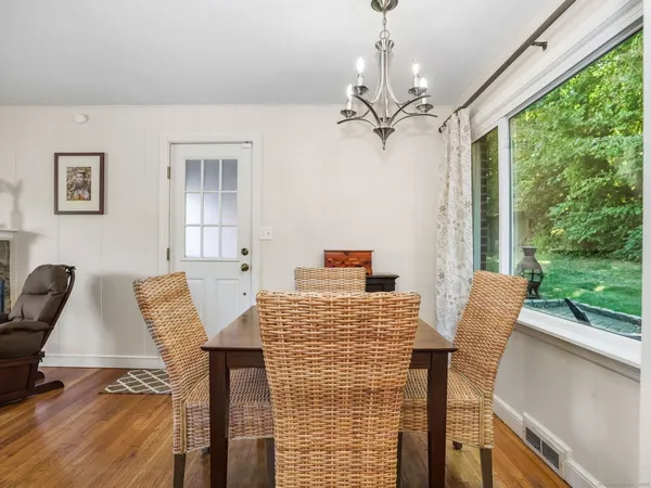 a view of a dining room with furniture window and outside view