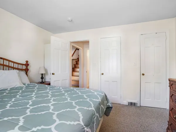 a bedroom with a bed and a cabinets