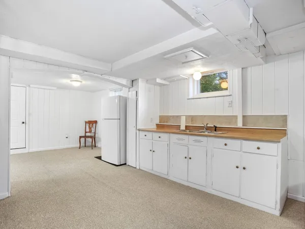 a spacious bathroom with a double vanity sink and a mirror
