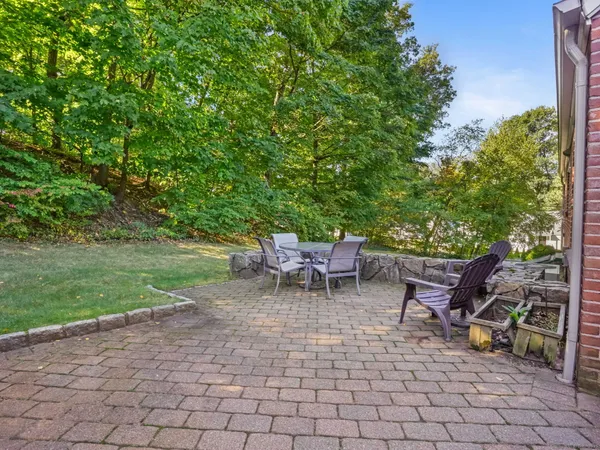 a view of a patio with table and chairs and potted plants