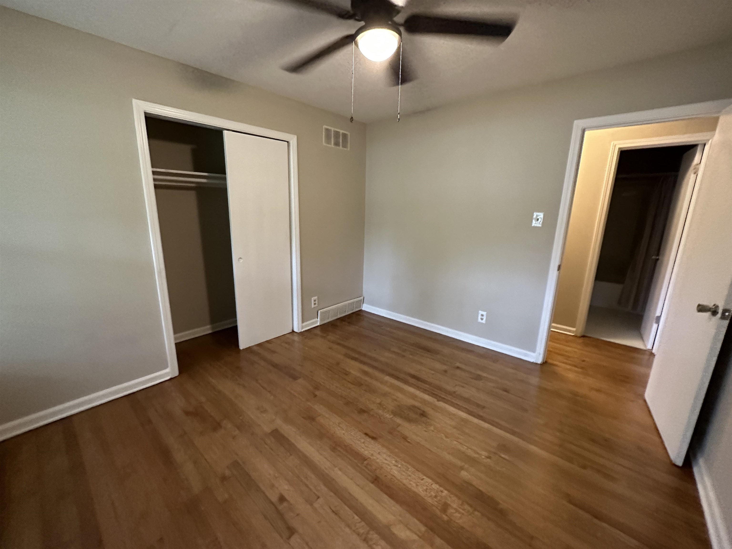 1594 Winfield Road Memphis, TN 38116 - Photo 22 of 29 wooden floor in an empty room with a window