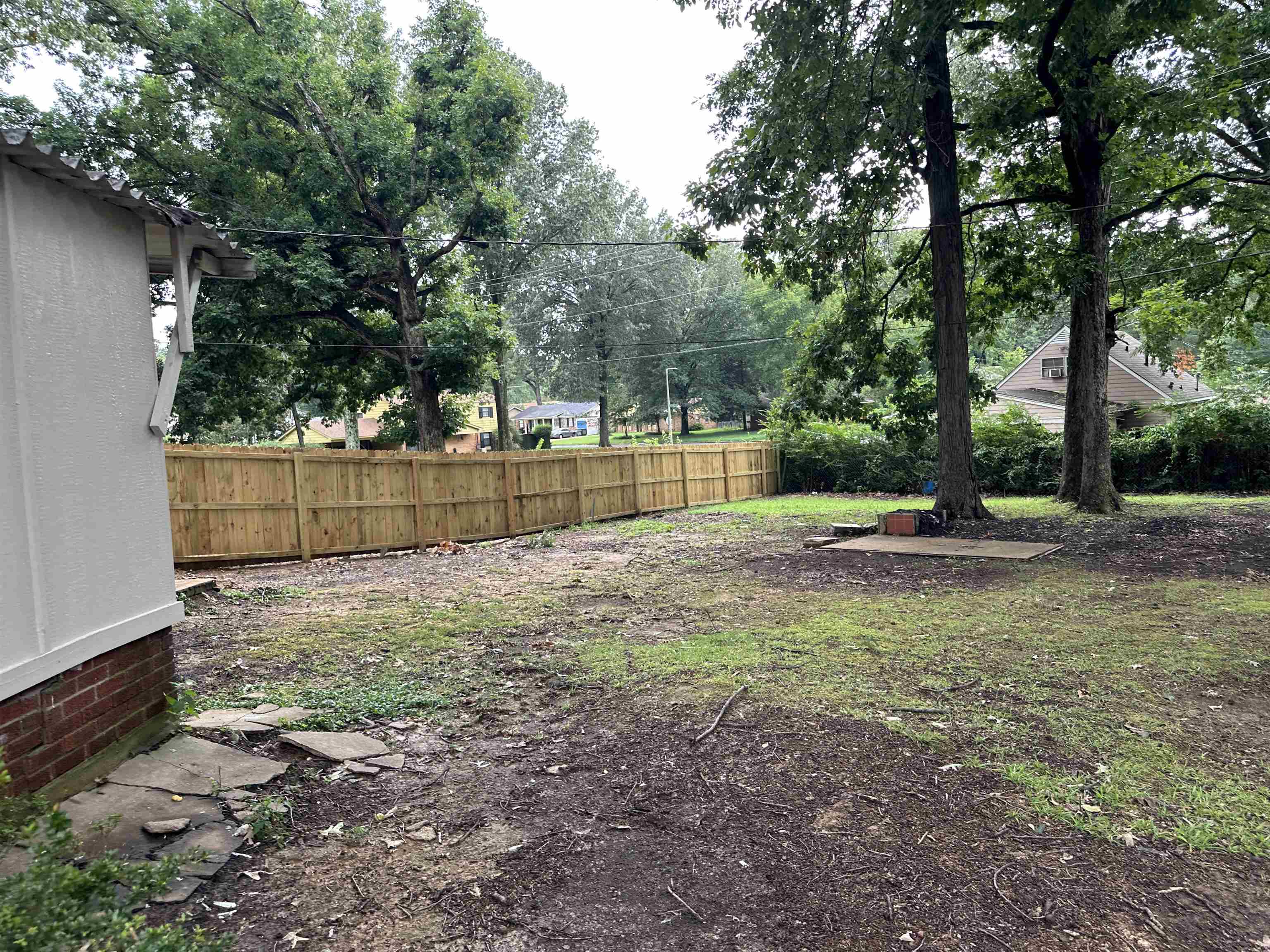 1594 Winfield Road Memphis, TN 38116 - Photo 29 of 29 a backyard of a house with lots of green space