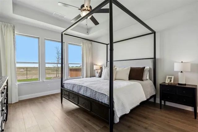 a bed room with a bed and a night stand