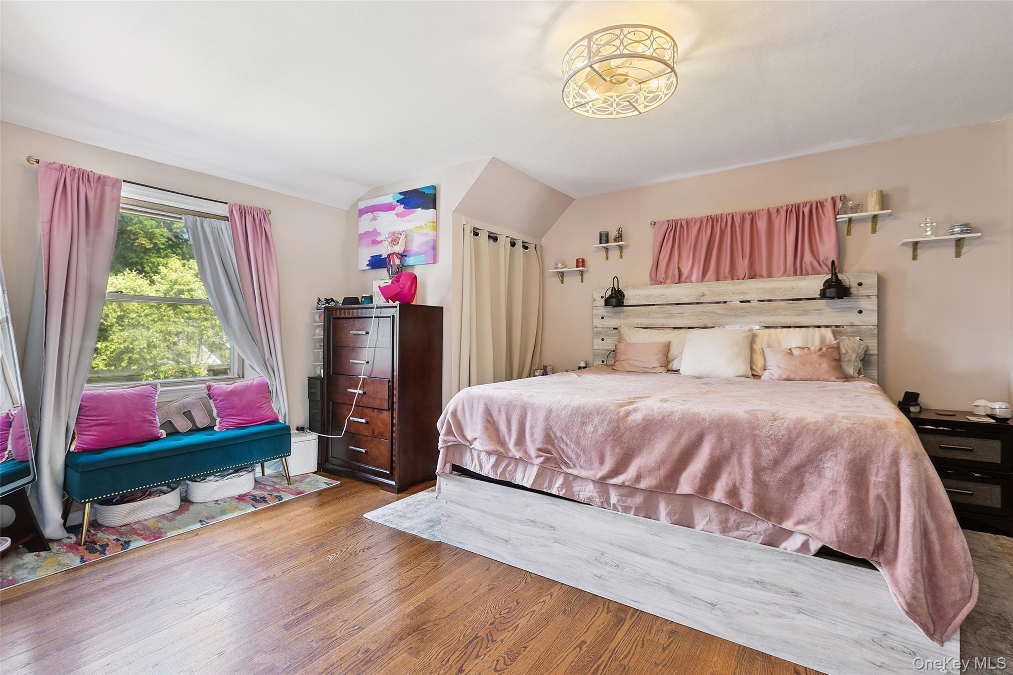 69 Ardell Road Bronxville, NY 10708 - Photo 20 of 48 a bedroom with a bed and a flat screen tv