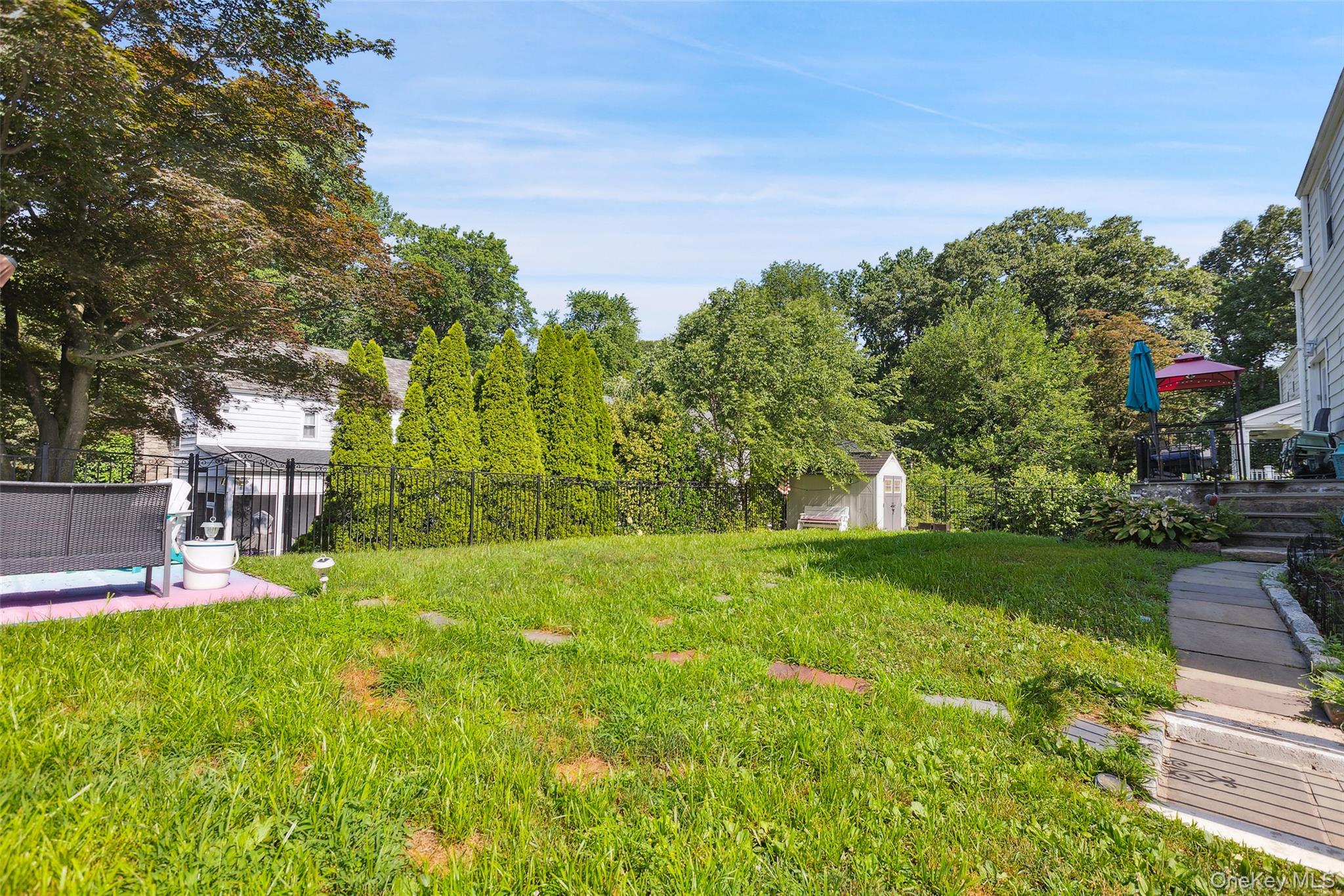 69 Ardell Road Bronxville, NY 10708 - Photo 29 of 48 a view of a backyard with a garden
