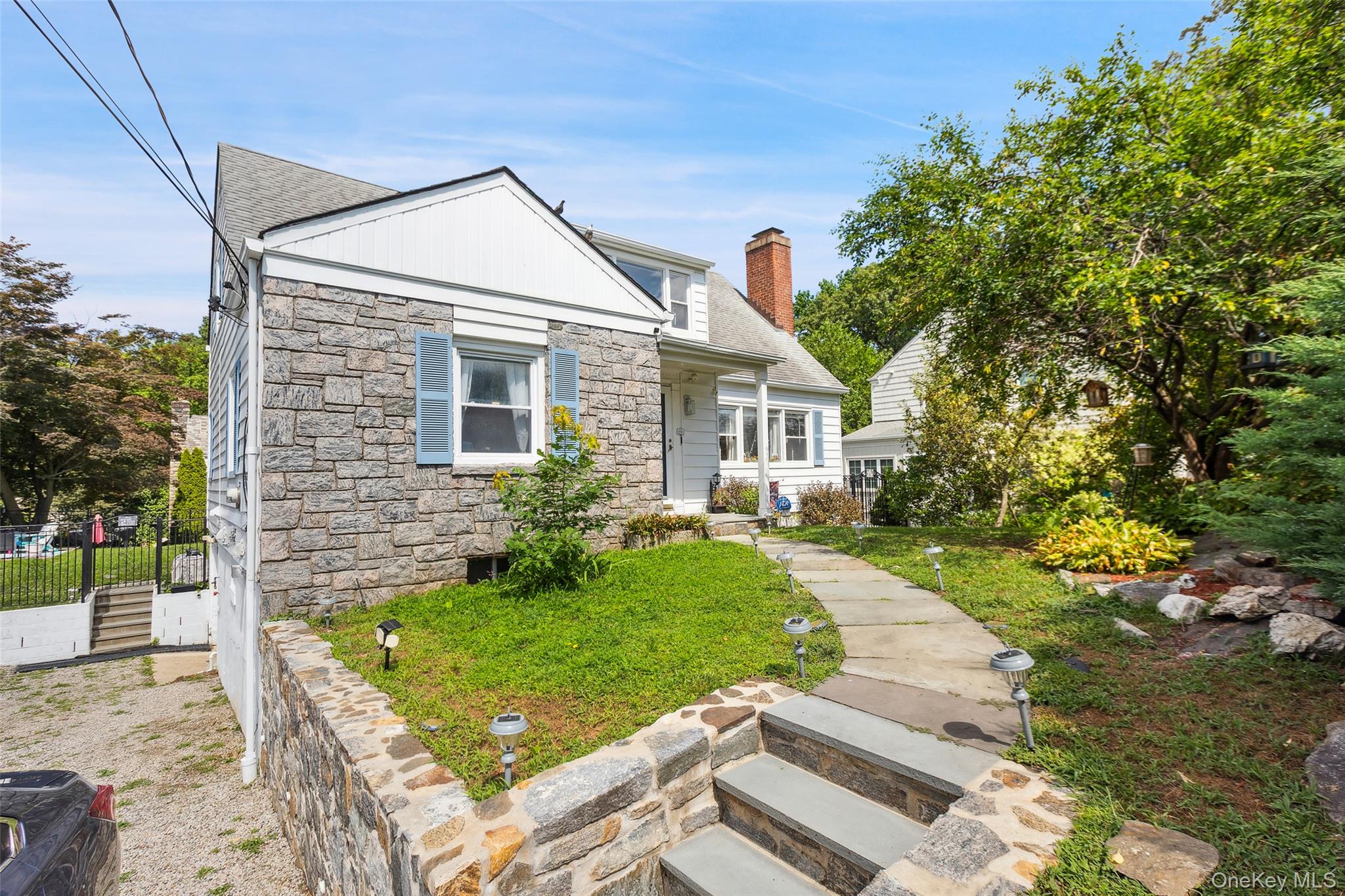 69 Ardell Road Bronxville, NY 10708 - Photo 3 of 48 a front view of a house with garden