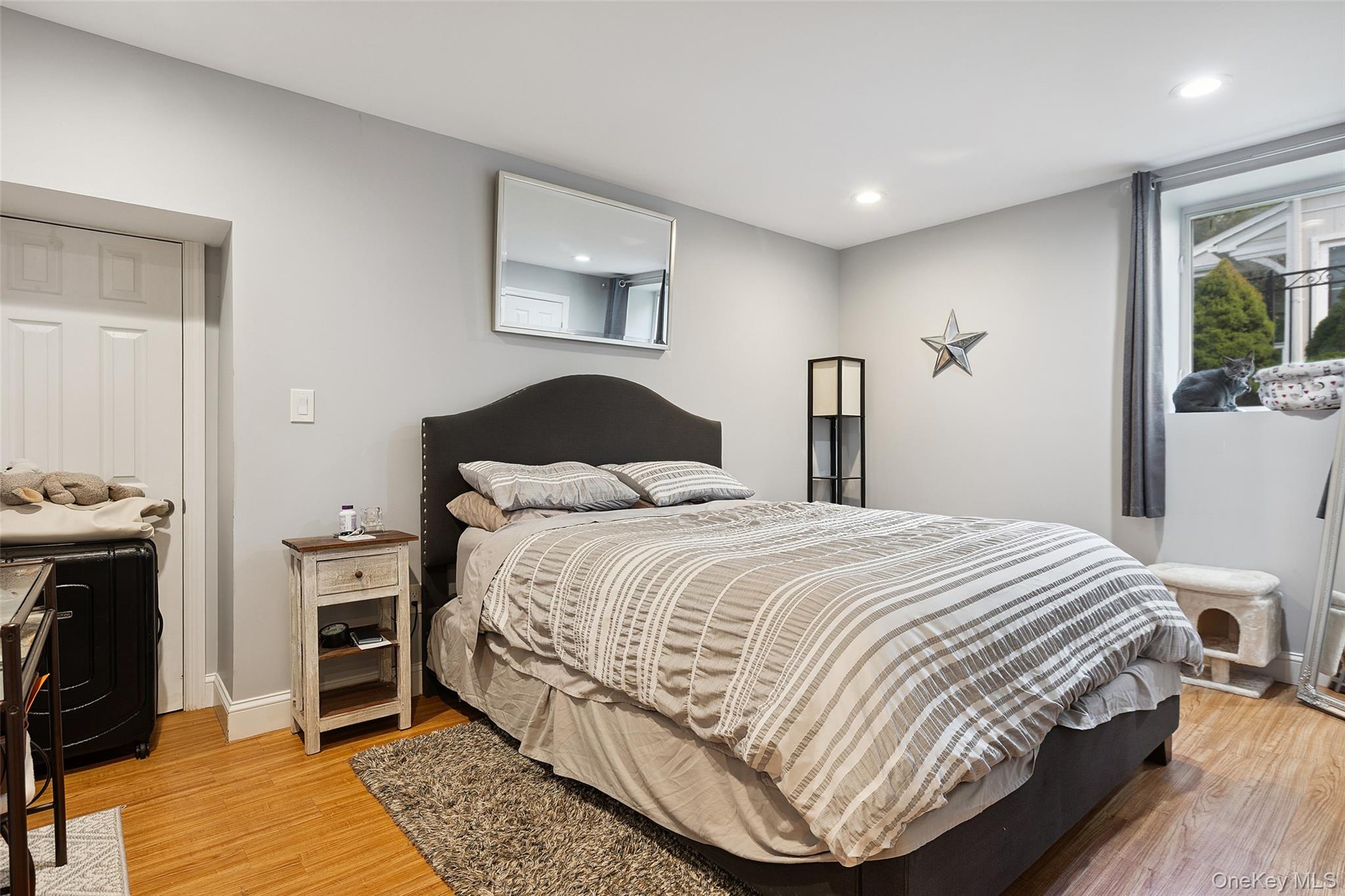 69 Ardell Road Bronxville, NY 10708 - Photo 35 of 48 a bedroom with a bed and a chandelier