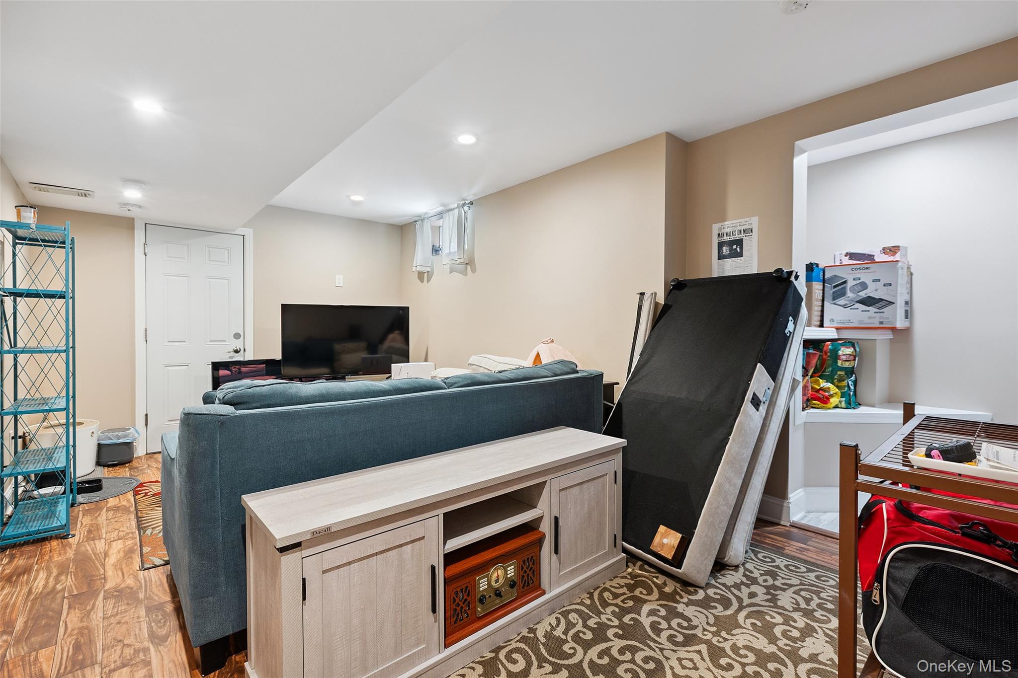 69 Ardell Road Bronxville, NY 10708 - Photo 37 of 48 a view of a workspace with furniture and a flat screen tv