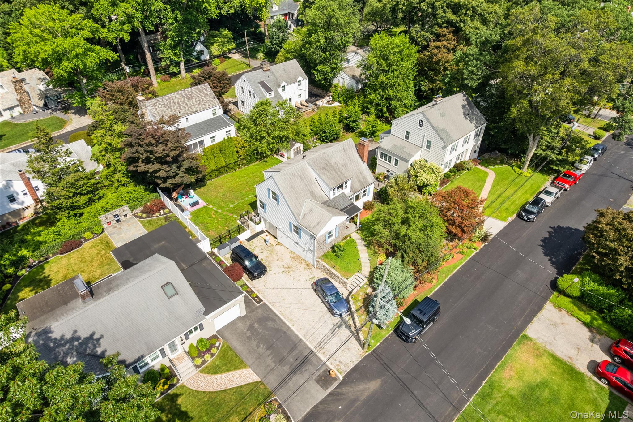 69 Ardell Road Bronxville, NY 10708 - Photo 40 of 48 an aerial view of a house with a yard and garden