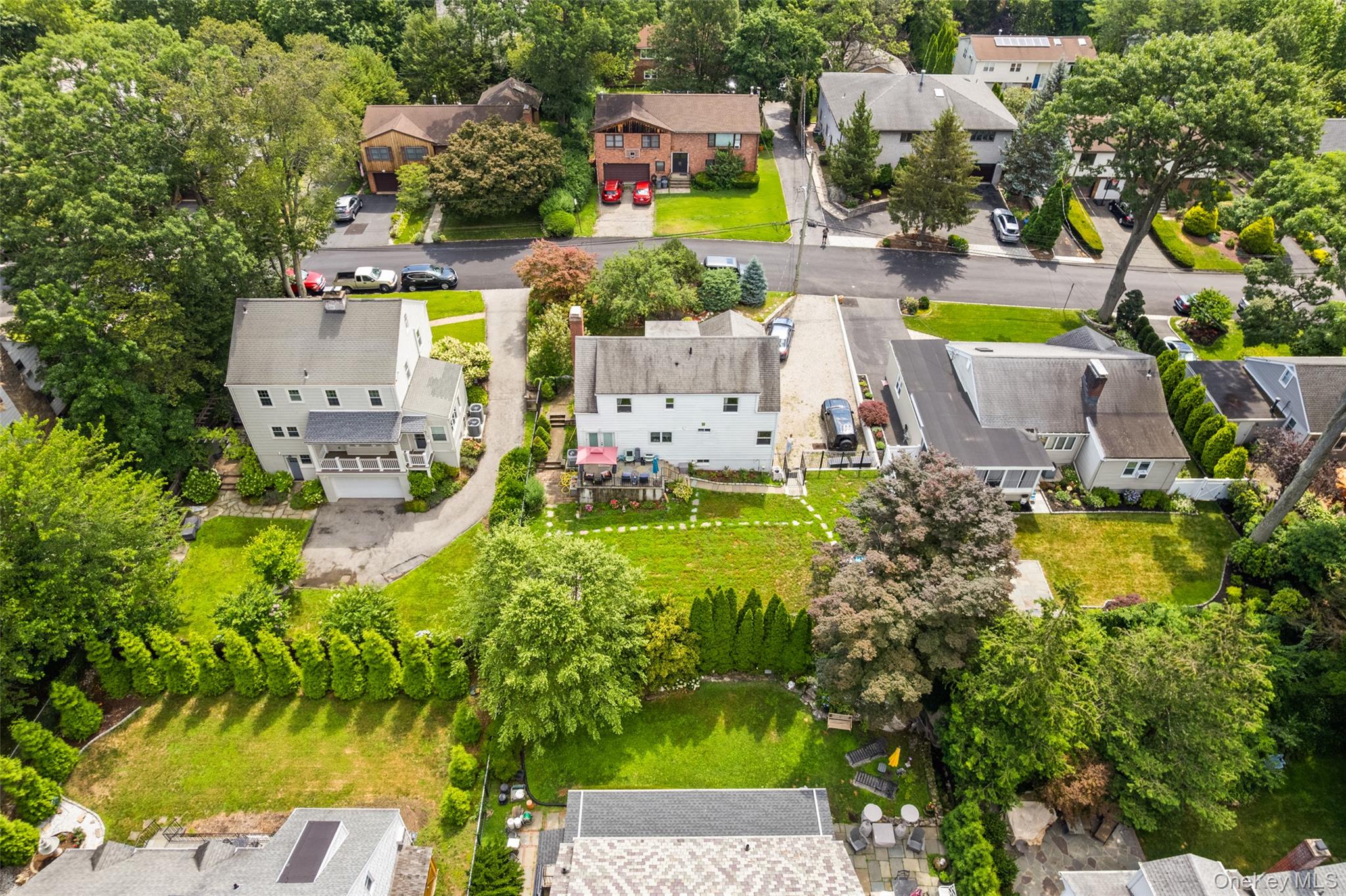 69 Ardell Road Bronxville, NY 10708 - Photo 43 of 48 an aerial view of a house with a garden and swimming pool