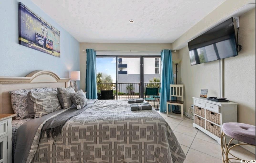 2000 South Ocean Boulevard, Unit V207AB Myrtle Beach, SC 29577 - Photo 11 of 11 Tiled bedroom with access to outside and a textured ceiling