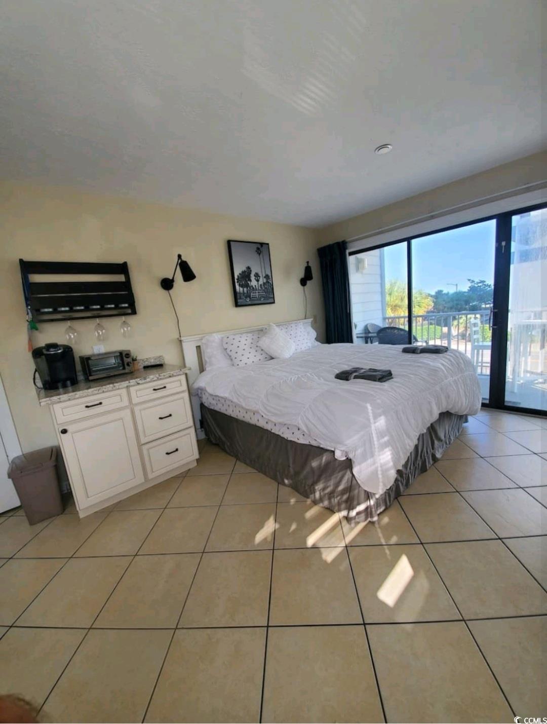 2000 South Ocean Boulevard, Unit V207AB Myrtle Beach, SC 29577 - Photo 2 of 11 Bedroom with light tile patterned floors and access to outside