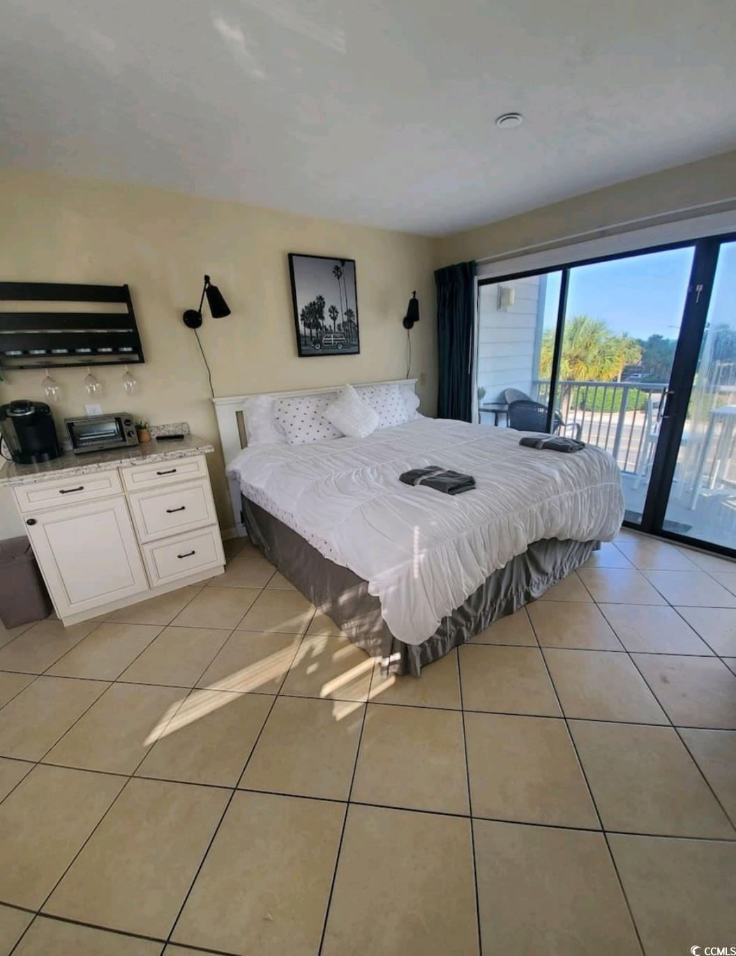 2000 South Ocean Boulevard, Unit V207AB Myrtle Beach, SC 29577 - Photo 4 of 11 Bedroom with light tile patterned floors and access to exterior