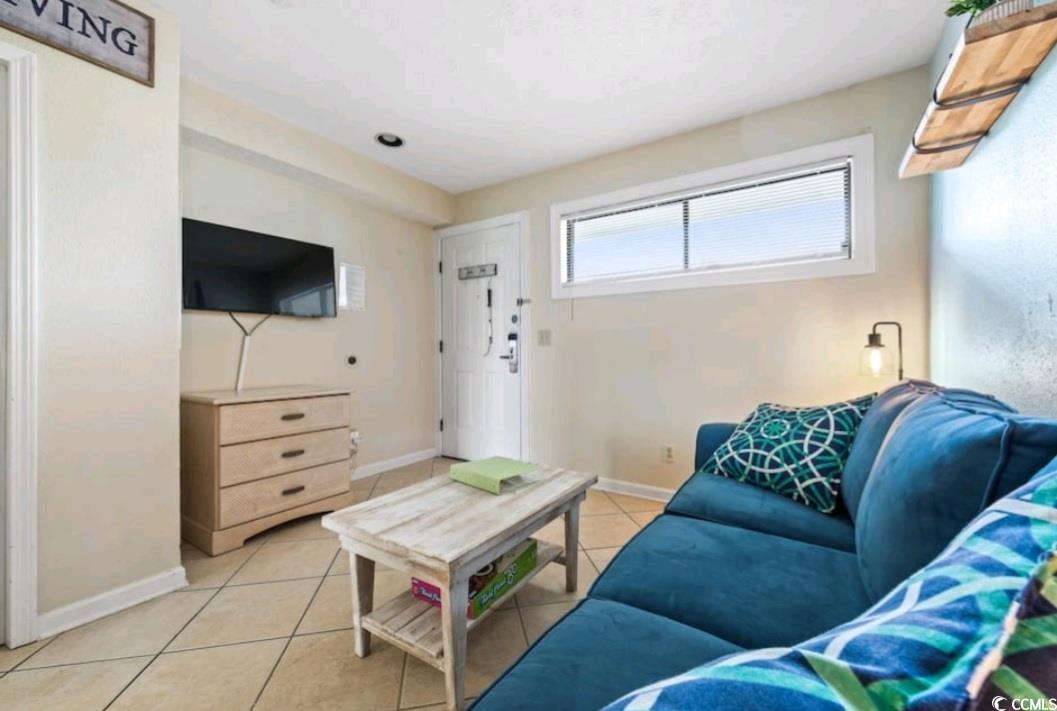 2000 South Ocean Boulevard, Unit V207AB Myrtle Beach, SC 29577 - Photo 7 of 11 Living room with baseboards and light tile patterned floors