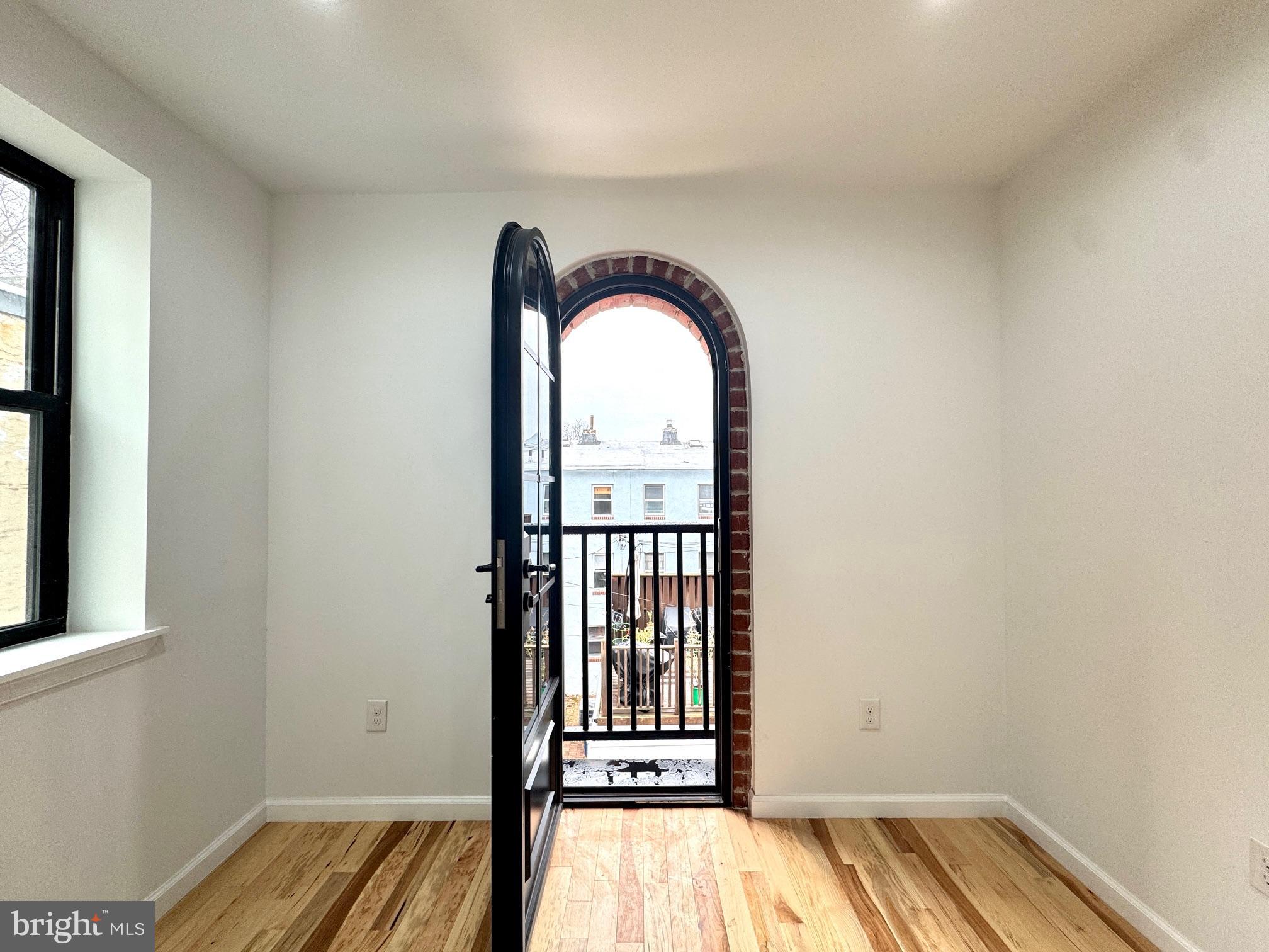 781 South 3rd Street, Unit 3 Philadelphia, PA 19147 - Photo 14 of 17 a view of a room with wooden floor and a window
