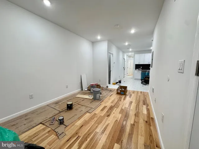 a view of a kitchen with a sink and cabinets
